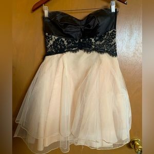 Cute, mini party dress. Black and light pink. From Teeze Me, size 7